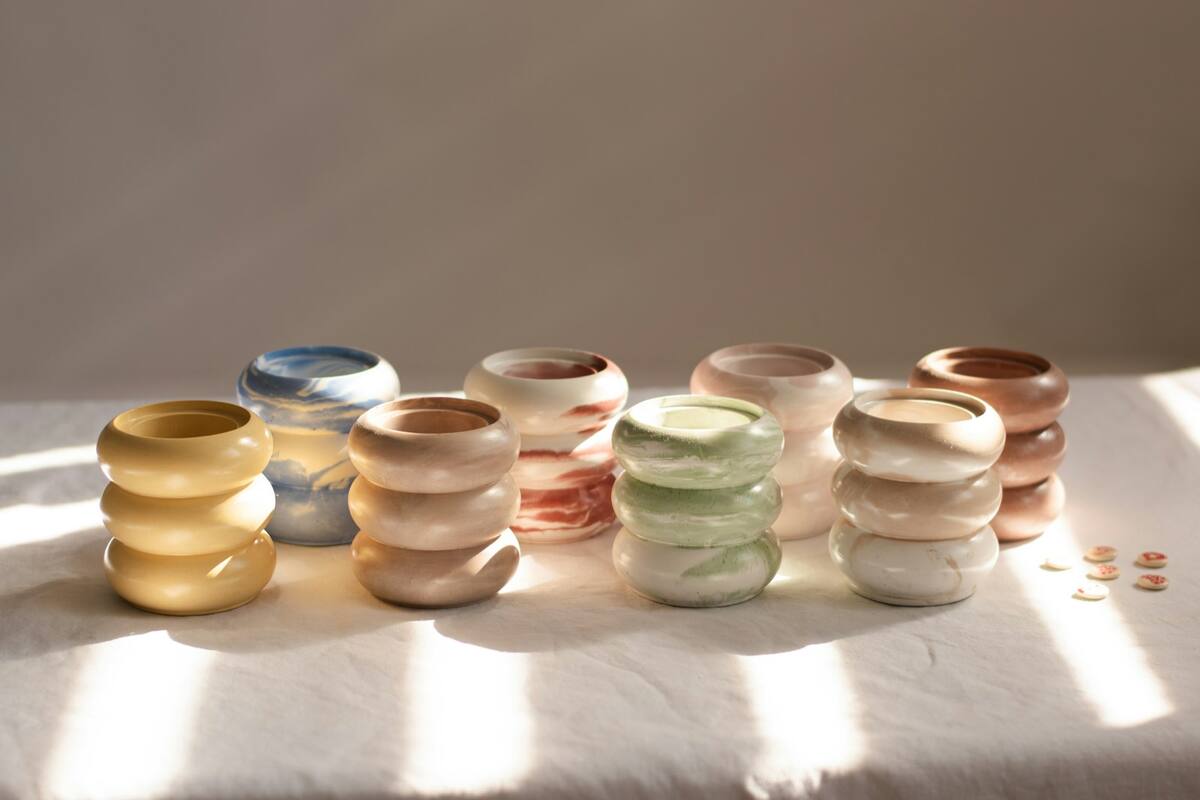 Small stoneware cups in warm sunlight